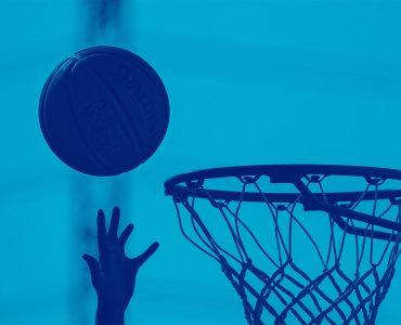 Hand attempting Basketball in net