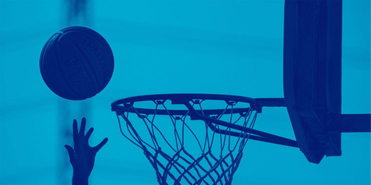 Hand attempting Basketball in net